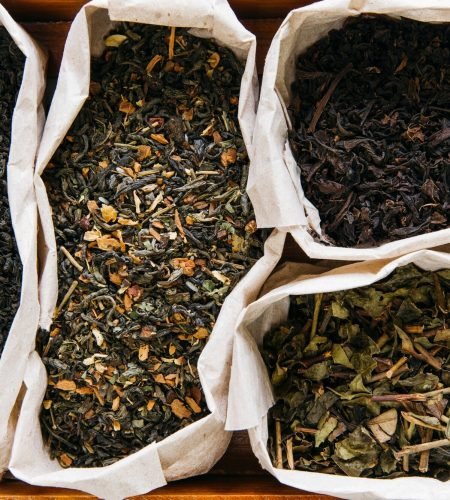 elevated-view-assortment-dry-tea-paper-bag_23-2148186282